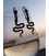 Minoan Silver Snake Earrings against beach sunset