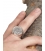 Male hand wearing large silver pegasus ring from Greece