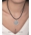 A Greek silver Festos disk pendant 
